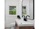 Bright bathroom with modern fixtures, vanity, and plenty of natural light at 1643 Flintwood Se Dr, Atlanta, GA 30316
