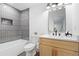 Updated bathroom with tile surround, modern vanity, and updated fixtures at 1643 Flintwood Se Dr, Atlanta, GA 30316