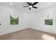 Bright bedroom with hardwood floors, large window, and a ceiling fan at 1643 Flintwood Se Dr, Atlanta, GA 30316
