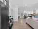 Open-concept living space with hardwood floors and a modern kitchen at 1643 Flintwood Se Dr, Atlanta, GA 30316