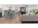 Open-concept living space with modern kitchen island and fireplace feature at 1643 Flintwood Se Dr, Atlanta, GA 30316