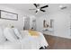Airy main bedroom featuring a ceiling fan, hardwood floors, and closet at 1643 Flintwood Se Dr, Atlanta, GA 30316