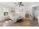 Sunlit main bedroom with a window, ceiling fan, and ensuite bathroom access at 1643 Flintwood Se Dr, Atlanta, GA 30316