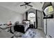 Comfortable bedroom featuring a large window, desk, and soft lighting at 2190 Ashley Crossing Ct, Lawrenceville, GA 30043