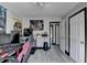 Bedroom/Office showcases natural light, decorated desk, and light hardwood floors at 2190 Ashley Crossing Ct, Lawrenceville, GA 30043