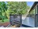 A spacious gray deck offers relaxing outdoor living at 2190 Ashley Crossing Ct, Lawrenceville, GA 30043