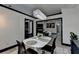 Open-concept dining area with modern lighting, view to living space, and sleek design at 2190 Ashley Crossing Ct, Lawrenceville, GA 30043