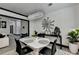 Open dining room with chandelier, view to living room and artistic decor at 2190 Ashley Crossing Ct, Lawrenceville, GA 30043