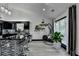 Modern kitchen with sleek cabinetry, hardwood floors, breakfast bar and stainless steel appliances at 2190 Ashley Crossing Ct, Lawrenceville, GA 30043