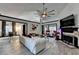 Bright living room with a vaulted ceiling, fireplace, and a large ceiling fan, perfect for relaxation at 2190 Ashley Crossing Ct, Lawrenceville, GA 30043