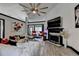 Spacious living room with a vaulted ceiling, fireplace, modern ceiling fan, and comfortable seating at 2190 Ashley Crossing Ct, Lawrenceville, GA 30043