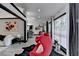Open-concept living space featuring hardwood floors and stylish décor, leading into the kitchen at 2190 Ashley Crossing Ct, Lawrenceville, GA 30043