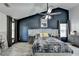 Beautiful main bedroom with dark accent wall, modern decor, and tray ceilings at 2190 Ashley Crossing Ct, Lawrenceville, GA 30043
