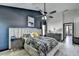 Spacious main bedroom with accent wall, tray ceiling, modern furnishings, and ensuite access at 2190 Ashley Crossing Ct, Lawrenceville, GA 30043