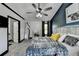 The main bedroom features accent wall, modern furniture, and ensuite access at 2190 Ashley Crossing Ct, Lawrenceville, GA 30043