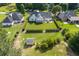Well-maintained backyard with manicured lawn, storage shed and trimmed hedges and established trees at 3027 Biltmore Woods Dr, Buford, GA 30519