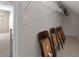 Unfinished attic storage space with shelving and chairs at 3027 Biltmore Woods Dr, Buford, GA 30519