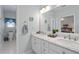 Bathroom with a double marble vanity and views into the main bedroom at 3027 Biltmore Woods Dr, Buford, GA 30519