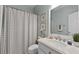 Bathroom featuring patterned shower curtain and a white marble vanity at 3027 Biltmore Woods Dr, Buford, GA 30519