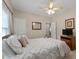 Cozy bedroom with a comfortable bed, ceiling fan, and natural light at 3027 Biltmore Woods Dr, Buford, GA 30519