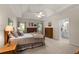 Comfortable bedroom with brick fireplace, ceiling fan, and neutral color scheme at 3027 Biltmore Woods Dr, Buford, GA 30519