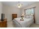 Bedroom with ceiling fan, wood furniture, and cozy decor at 3027 Biltmore Woods Dr, Buford, GA 30519