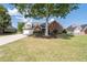 Beautiful brick home with a well-maintained lawn, mature tree, and ample driveway space offers suburban charm at 3027 Biltmore Woods Dr, Buford, GA 30519