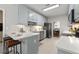 Well-lit kitchen with sleek countertops, stainless steel appliances, and a convenient breakfast bar at 3027 Biltmore Woods Dr, Buford, GA 30519