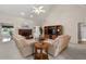 Spacious living room featuring a brick fireplace, vaulted ceiling, neutral carpeting, and an open layout at 3027 Biltmore Woods Dr, Buford, GA 30519