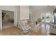 Bright living room with tile floor, french doors, and rattan furniture at 3027 Biltmore Woods Dr, Buford, GA 30519