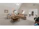 Spacious living room with neutral decor, vaulted ceilings, and comfortable seating arrangement at 3027 Biltmore Woods Dr, Buford, GA 30519