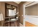 A stylish bathroom features a granite-topped vanity, large mirror, and access to a hallway at 567 N Palisades Se Cir, Marietta, GA 30067