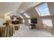 Versatile bonus room with skylights, neutral carpet, media center and desk at 567 N Palisades Se Cir, Marietta, GA 30067