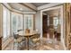 Bright breakfast area featuring a round table and tile flooring, adjacent to dining room at 567 N Palisades Se Cir, Marietta, GA 30067