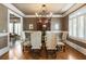 Formal dining area with hardwood floors, chandelier, and large table with seating for six at 567 N Palisades Se Cir, Marietta, GA 30067