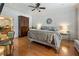 Spacious main bedroom features beautiful hardwood floors, neutral decor, and an adjacent bathroom at 567 N Palisades Se Cir, Marietta, GA 30067