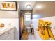 Bright bathroom featuring white tiles, a window, a shower with unique orange shower curtains, and a modern toilet at 1343 Renee Dr, Decatur, GA 30035