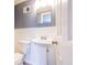 Well-maintained bathroom with a pedestal sink, toilet, and modern fixtures, providing a clean and functional space at 1343 Renee Dr, Decatur, GA 30035