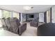 Cozy living room featuring comfortable seating, a modern entertainment center, and a sliding door leading to the outside at 1343 Renee Dr, Decatur, GA 30035