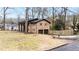 Brick home exterior showcases an attached two-car garage and manicured lawn, highlighting its curb appeal at 1343 Renee Dr, Decatur, GA 30035