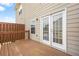 Back deck featuring wood and rail construction with double doors leading inside at 5529 Festival Ave, Fairburn, GA 30213