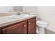 Bathroom featuring a vanity, a toilet, and neutral walls and flooring at 5529 Festival Ave, Fairburn, GA 30213