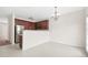 Spacious kitchen with dark wood cabinets and stainless steel appliances at 5529 Festival Ave, Fairburn, GA 30213