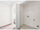 Bright laundry room with washer/dryer hookups and storage space at 5529 Festival Ave, Fairburn, GA 30213