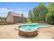 Beautiful backyard showcasing a in-ground pool, hot tub, patio, gazebo and a spacious two-story house at 6086 Willowpond Ct, Douglasville, GA 30135