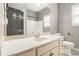 Bathroom featuring a white vanity, large mirror, and white toilet, offering a clean and classic look at 6086 Willowpond Ct, Douglasville, GA 30135