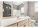 Bathroom featuring a white vanity, ample counter space, and a large mirror at 6086 Willowpond Ct, Douglasville, GA 30135