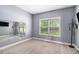 Bedroom featuring a large mirror and a window for natural light at 6086 Willowpond Ct, Douglasville, GA 30135