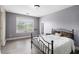 Cozy bedroom with wood floors, natural light and a comfortable bed at 6086 Willowpond Ct, Douglasville, GA 30135