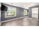 Bright bedroom features two large windows, neutral walls, and a walk-in closet for ample storage at 6086 Willowpond Ct, Douglasville, GA 30135